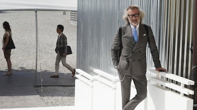 The most personal way we've seen someone wear a suit. It's all in the details: the tie, the backpack, the silver chain. Enrico Labriola / Pitti Immagine