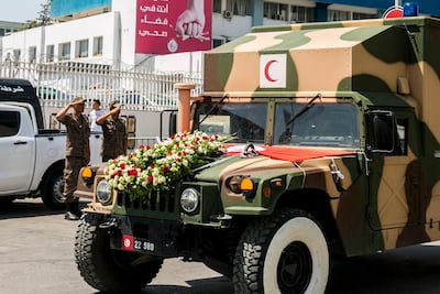 A convoy carrying the body of Tunisian President Beji Caid Essebsi leaves the military hospital in Tunis on July 26, 2019. AP Photo