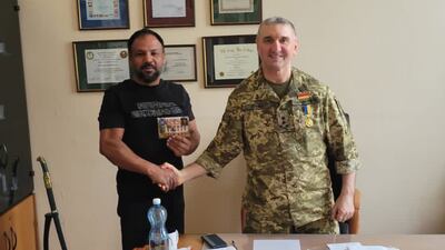 Mr Pal with former general Igor Gordevich, who runs a military boarding school in Kyiv that requires supplies and aid. Photo: Nitesh Pal