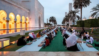 Iftar meals are distributed to visitors at the Sheikh Zayed Grand Mosque in Abu Dhabi. Victor Besa / The National