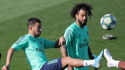 Real Madrid's Eden Hazard and Marcelo during training. Reuters