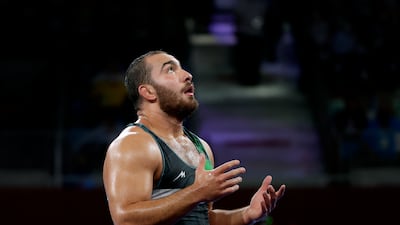 Iranian wrestler Hossein Amir Zare looks exhausted after defeating Zhiwei Deng of China in an epic bout to win the men’s freestyle 125kg bronze.