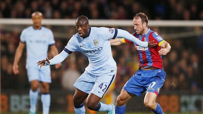 Yaya Toure of Manchester City dribbles away from Glenn Murray of Crystal Palace on Monday in their Premier League match. John Sibley / Reuters / Action Images