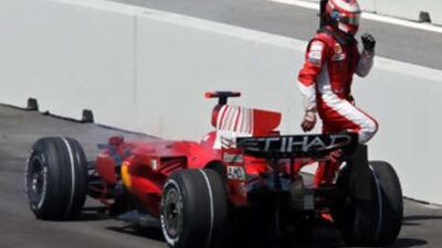 Ferrari's Kimi Raikkonen walks away from his car as he has engine failure during the European Formula One Grand Prix on August 24 in Valencia, Spain.