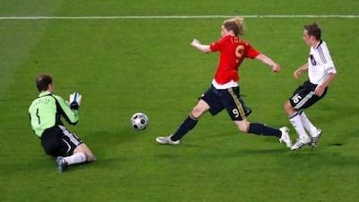 Fernando Torres, centre, scored the winning goal for Spain in the final of Euro 2008, after beating German’s Philipp Lahm, right, to a through ball. Michael Probst / AP Photo