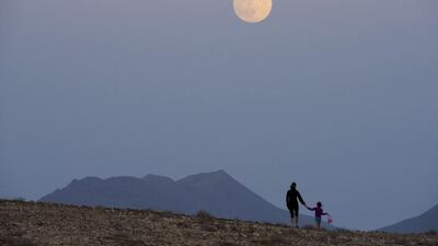 A mother and her child walk under the supermoon at Tuineje in Fuerteventura at the Canary Islands, Spain. Carlos de Saá / EPA