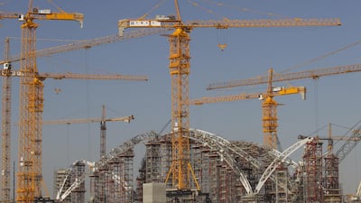 Above, the 180-metre arch span of the Midfield Terminal complex being built at the Abu Dhabi airport. Mona Al Marzooqi / The National