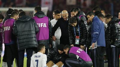 Real Madrid’s Cristiano Ronaldo receives treatment prior to the start of extra-time. Shuji Kajiyama / AP Photo