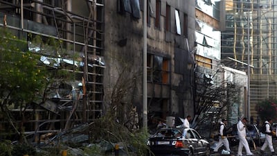 Lebanese forensic experts inspect the site of the bomb blast at Blom Bank in Beirut on June 12. Patrick Baz / AFP