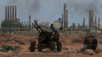 The price of oil climbed to $126 this year amid unrest in parts of the Middle East and the shutdown of supplies from Libya. Hussein Malla / AP Photo