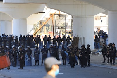 Security forces gather as protesters supporting Iraqi Shiite armed groups approach the Green Zone. Reuters