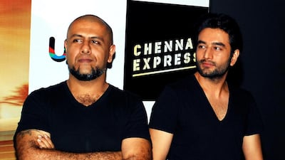 Indian Bollywood music directors Vishal Dadlani and Shekhar Ravjiani pose during a preview for the forthcoming Hindi film Chennai Express in Mumbai on June 13, 2013. AFP PHOTO/STR