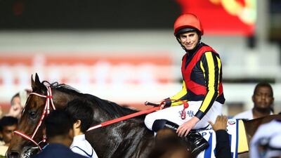 DUBAI, UNITED ARAB EMIRATES - MARCH 26: Ryan Moore celebrates after riding Real Steel to victory in the Dubai Turf Sponsored By DP World as part of the Dubai World Cup at Meydan Racecourse on March 26, 2016 in Dubai, United Arab Emirates. (Photo by Francois Nel/Getty Images)