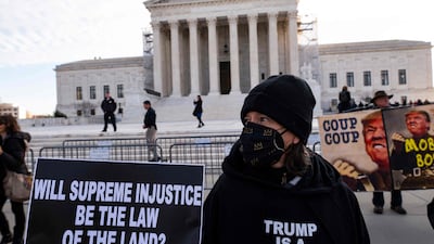 A protest outside the US Supreme Court in Washington this month as it considers whether Donald Trump is eligible to run in the 2024 presidential election. AFP