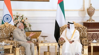 ABU DHABI, UNITED ARAB EMIRATES - February 10, 2018: HH Sheikh Mohamed bin Zayed Al Nahyan Crown Prince of Abu Dhabi Deputy Supreme Commander of the UAE Armed Forces (R), receives HE Narendra Modi Prime Minister of India (L), at the Presidential Airport. ( Omar Al Askaar for the Crown Prince Court) ---