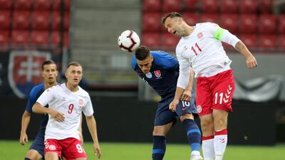 Striker (captain): Christian Offenburg, right – Part-time salesman, who plays for Danish third-tier side Avarta. AP Photo
