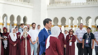 Tim Shriver, Special Olympics Chairman, tours the mosque with the teams. Wam