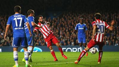 Arda Turan of Atletico Madrid scores his team's third goal during their Champions League victory over Chelsea on Wednesday. Clive Rose / Getty Images / April 30, 2014