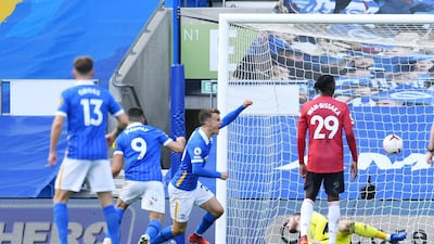 Brighton's Solly March celebrates scoring their equaliser deep into added time. Reuters