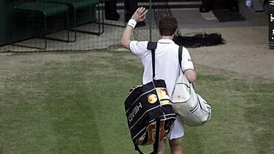 A dejected Andy Murray says goodbye to this year's Wimbledon.