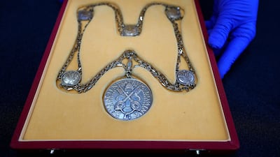 The Papal Medal awarded to Stephen Hawking. AP Photo