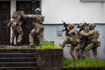 Soldiers take part in the Nato military exercise 'Flaming Sword 2022' at a training range near the village Maisiejunai, in Lithuania. AP