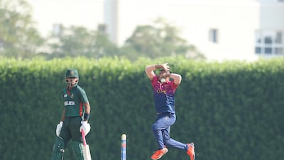 UAE captain Aayan Afzal Khan bowls against Bangladesh.
