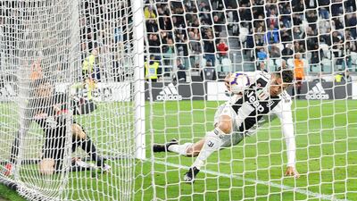 Juventus striker Cristiano Ronaldo retrieves the ball after heading in an equaliser against Torino. EPA