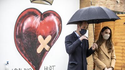 Britain's Prince William and his wife Kate, Duchess of Cambridge, visit an ambulance station in east London. AP