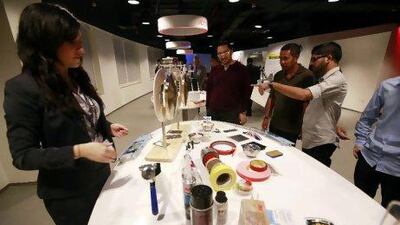 Dubai , United Arab Emirates- January 27, 2011 ; Visitors browse the new products being displayed at the newly opened 3M Innovation Centre in Dubai.