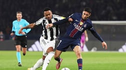 Newcastle United's Joe Willock vies for the ball with Paris Saint-Germain's Achraf Hakimi during their Uefa Champions League clash at the Parc des Princes stadium. AFP