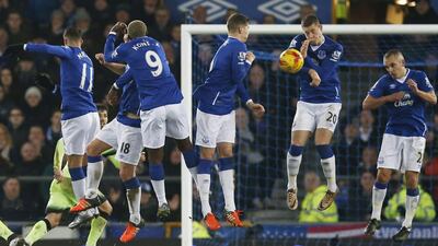 Manchester City’s Yaya Toure has his free kick blocked by the Everton wall during the first leg of the Capital One Cup semi-final. Andrew Yates / Reuters