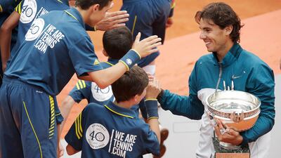 Always a humble and simple man, the Spaniard did not forget to shake hands with ball boys after the presentation ceremony. An example for the younger generation, perhaps. Philippe Wojazer / Reuters
