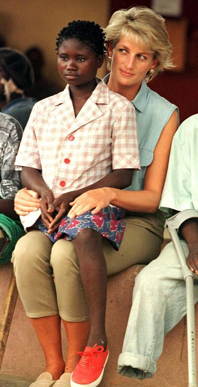 Diana, Princess of Wales, spends time with 11-year-old Sandra Thijika, in 1997. Reuters