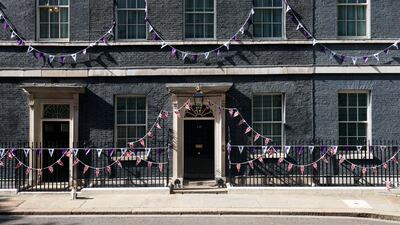 Larry the Cat, Chief Mouser to the Cabinet Office, sits outside Downing Street, London, adorned in bunting before the platinum jubilee celebrations, in London. AP