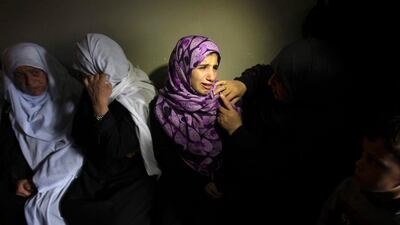 Relatives of Palestinian Matter Abu al-Atta, who was killed in Israeli shelling on Saturday, mourn during his funeral in Gaza. Ibraheem Abu Mustafa / Reuters