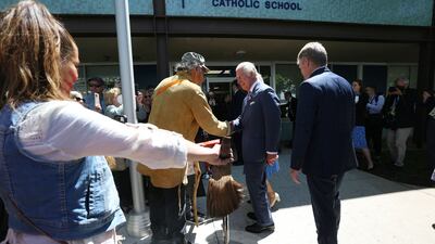 Britain's Prince Charles greets member of the public during a visit at Assumption Catholic school May 18, 2022 in Ottawa. AFP