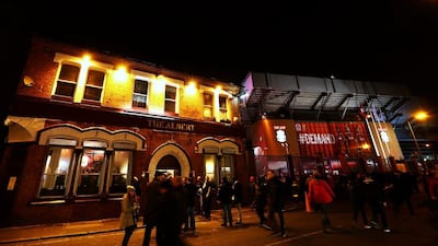 Fans gather outside Anfield before the Premier League match between Liverpool and Swansea City on Monday. Clive Brunskill / Getty Images