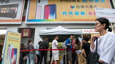 Taiwanese people queue outside an Apple store to purchase new Apple iPhone X in Taipei, Taiwan. EPA