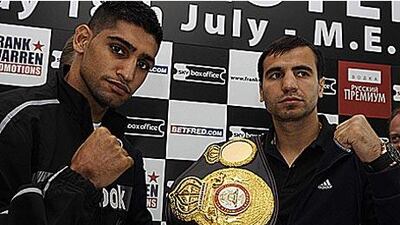 The Ukrainian WBA light-welterweight champion Andreas Kotelnik, right, poses with Amir Khan ahead of their fight at the MEN arena tonight.