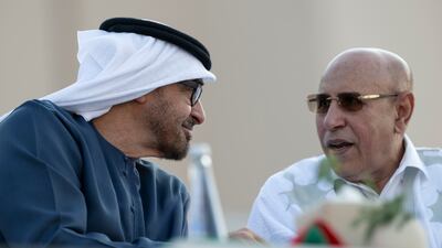 Sheikh Mohamed speaks with Mr Ould Ghazouani at the parade. Abdulla Al Neyadi / Presidential Court