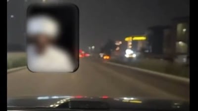 The motorist was distracted while driving and posed a danger to other road users, authorities said. Photo: Abu Dhabi Police