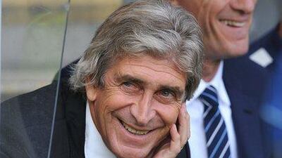 Manchester City manager Manuel Pellegrini smiles during his side's 4-2 win over Hull City in the Premier League on Saturday. Steve Parkin / AFP / September 27, 2014