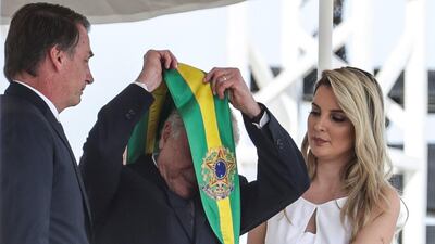 Jair Bolsonaro receives the presidential band from his predecessor, former Brazilian President Michel Temer. EPA