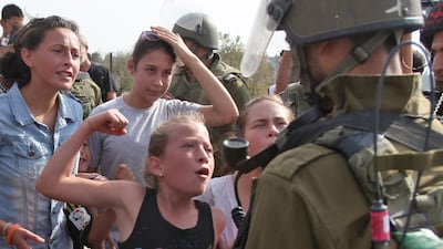 Taken in November 2012 Ahed gestures in front of an Israeli soldier during a protest against the confiscation of Palestinian land by Israel. AFP
