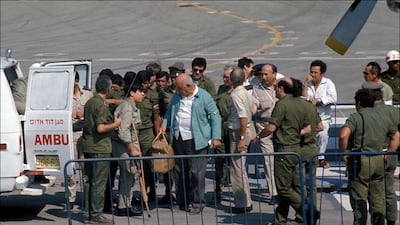The treaty between Israel and Syria took hold on May 31, 1974, with an early exchange of prisoners of war in Tel Aviv. Here, the seriously injured are led out first