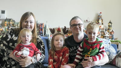 The display is spread out on the Bradley family's dining table. Seen here is Robert Bradley with his wife Noleen, daughter, Evie, and sons, Tom, 2 and Adam, 11 months.
