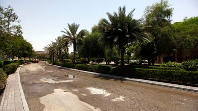 In its place is the dirt, debris and sand that was picked up by the water and although most of the small side roads have now been reopened, the main entrance to Discovery Gardens and the mall remained blocked off until last night.