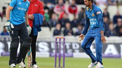 Jos Buttler, left, was run out for failing to back up at the non-striker's crease in an ODI against Sri Lanka. Andrew Yates / AFP