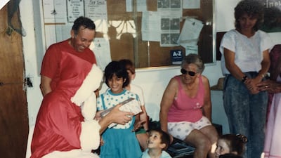 Michelle Leboutte receives a gift from Santa Claus at the Sailing Club in the 1980s. Courtesy: Michelle Leboutte.